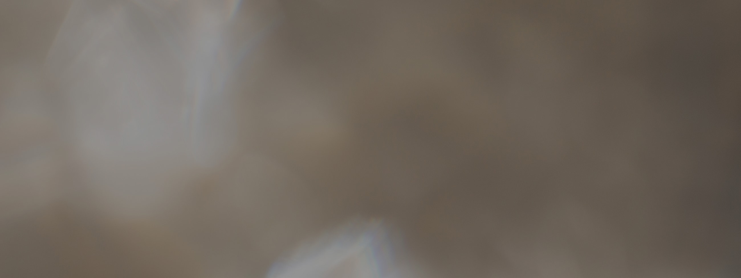 Abstract blurred background with soft light patterns.