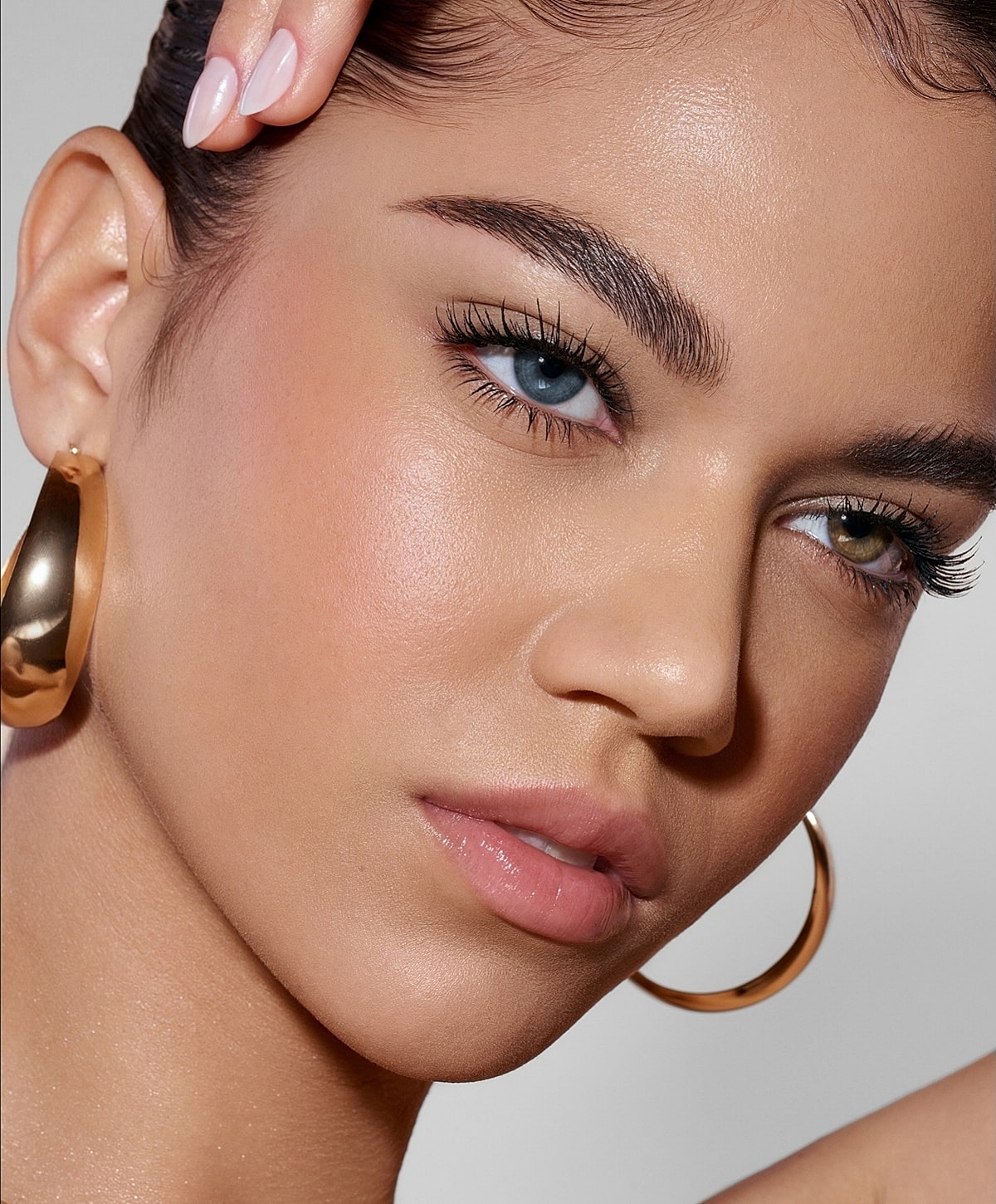 Close-up of a model with striking blue eyes.
