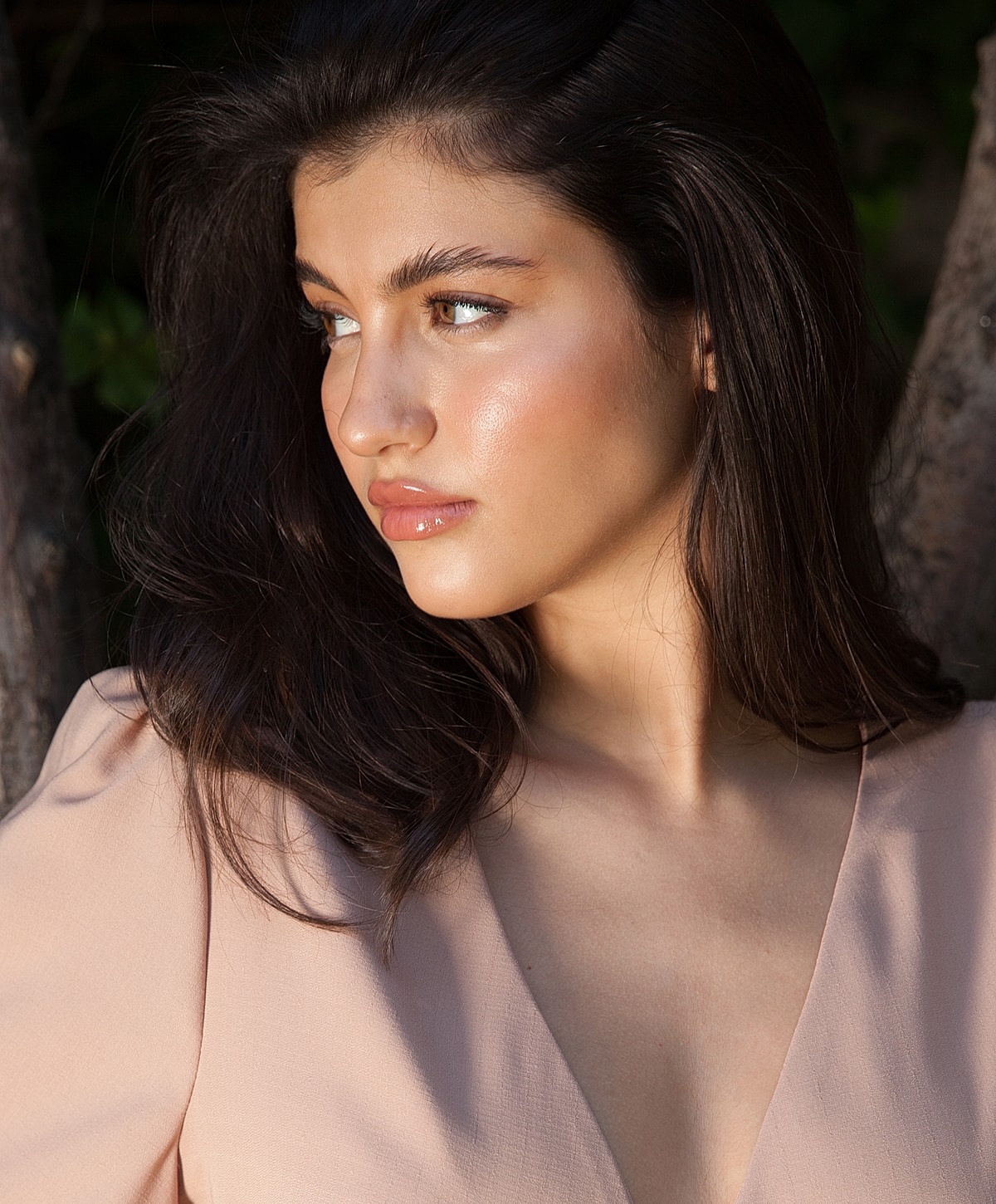 Profile view of a woman with long dark hair.