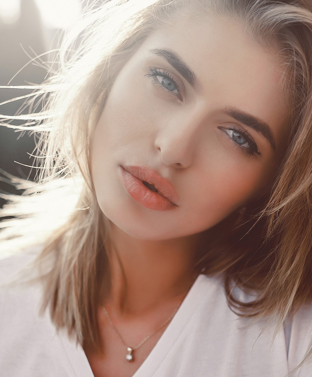 Close-up of a woman with soft features.