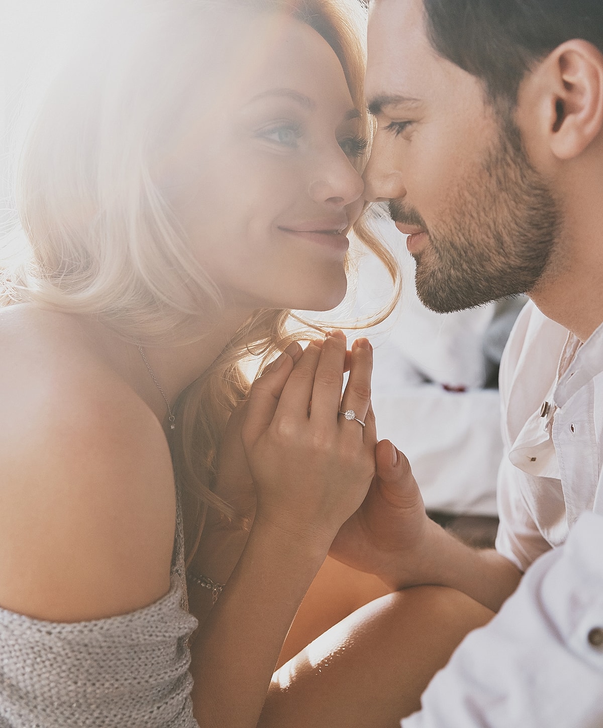 Couple sharing a tender moment indoors.